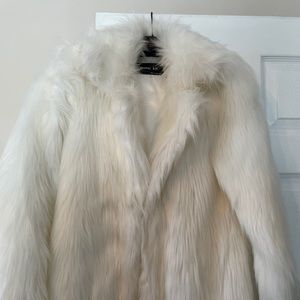 Faux fur, looks and feels like rabbit. Never worn
